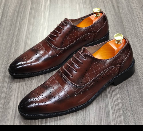 This is a nice pair of dark brown shoes. It is unique and comes unique. This shoe makes one looks attractive and presentable for any occasions. It can be used for office and any other celebrations one plan to attend. The soles are very strong and solid and it has a round front and shinning leather. Inside leather is brown. The ropes are very solid. Available size 40 - 45.