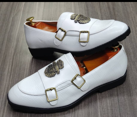 This is an outstanding pair of white shoes. It is unique and comes a unique white color. Made up of golden metals at the top and on the sides. This shoe makes one looks attractive and presentable for any occasions. It can be used for office and any other celebrations one plan to attend. The soles are very strong and solid and it has a round front and the inside leather is brown. Available size 41 - 44.