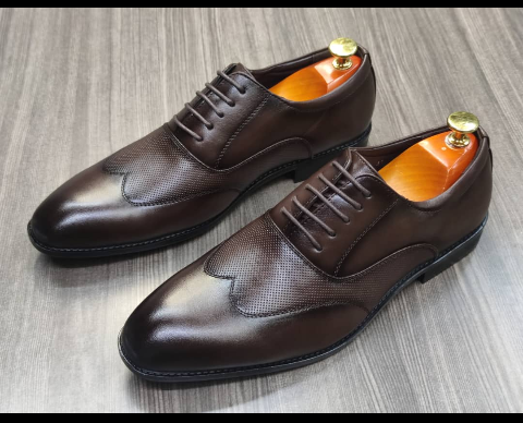 This is a nice pair of dark brown shoes. It is unique and comes unique. This shoe makes one looks attractive and presentable for any occasions. It can be used for office and any other celebrations one plan to attend. The soles are very strong and solid and it has a round front and shinning leather. Inside leather is brown. The ropes are very solid. Available size 40 - 44.