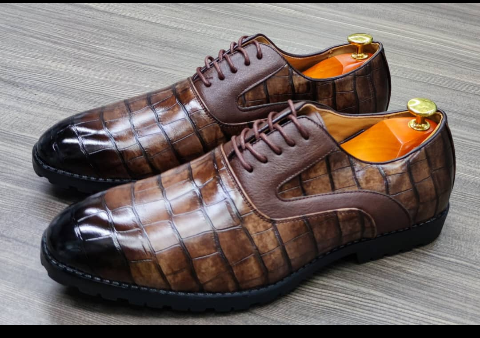 This is a nice pair of dark brown shoes. It is unique and comes unique. This shoe makes one looks attractive and presentable for any occasions. It can be used for office and any other celebrations one plan to attend. The soles are very strong and solid and it has a round front and shinning leather. Inside leather is brown. The ropes are very solid. Available size 40 - 44.