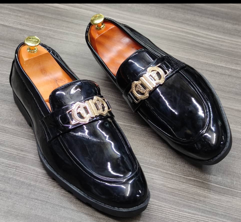 This is a nice pair of black shoes. It is unique and comes unique. Made up of quality material This shoe makes one looks attractive and presentable for any occasions. It can be used for office and any other celebrations one plan to attend. The soles are very strong and solid and it has a round front. Available size 40, 41, 43- 45.46