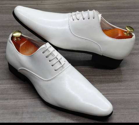 This is an outstanding pair of black shoes. It is unique and comes unique. Made up of golden metal at the top. This shoe makes one looks attractive and presentable for any occasions. It can be used for office and any other celebrations one plan to attend. The soles are very strong and solid and it has a round front. Available size 41 - 44.