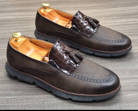 This is an outstanding pair of shoes. It is unique and comes unique. Made up of flexible leather. This shoe makes one looks attractive and presentable for any occasions. It can be used for celebrations and outings. The soles are very strong and solid and it has a round front and the shoe is dark brown or grey in color. Available size 40