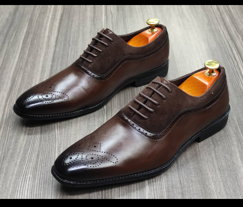 This is a nice pair of dark brown shoes. It is unique and comes unique. This shoe makes one looks attractive and presentable for any occasions. It can be used for office and any other celebrations one plan to attend. The soles are very strong and solid and it has a round front and shinning leather. Inside leather is brown. The ropes are very solid. Available size 40 - 44.