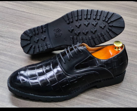 This is an outstanding pair of black shoes. It is unique and comes unique. Made up of solid leather. This shoe makes one looks attractive and presentable for any occasions. It can be used for office and any other celebrations one plan to attend. The soles are very strong and solid and it has a round front and the leather is brown. Available size 41 - 44.