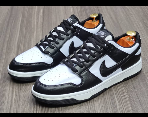 Black and white sport shoe, sneaker.