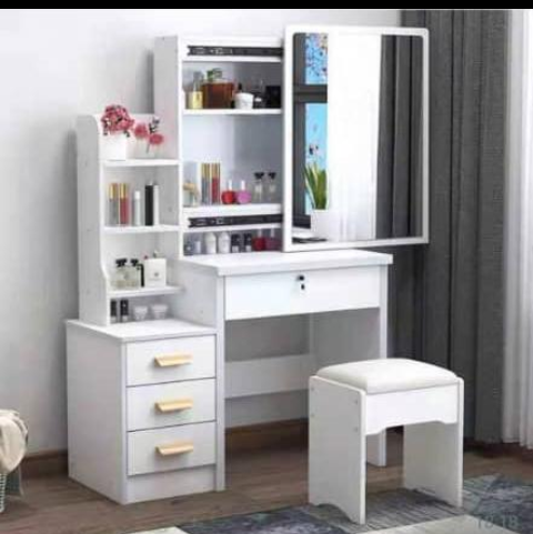 This is an original cupboard you can use at home. It is very strong and solid and made of wood and its very portable. This cupboard has 3 drawers and  shelves. It also has a mirror and a comfortable chair. It can be used for saloon, beauty parlor and at home. It is made up of brown, white and pink colors. 