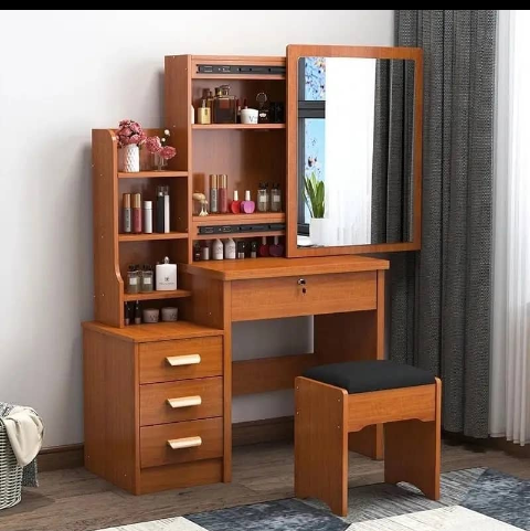 This is an original cupboard you can use at home. It is very strong and solid and made of wood and its very portable. This cupboard has 3 drawers and  shelves. It also has a mirror and a comfortable chair. It can be used for saloon, beauty parlor and at home. It is made up of brown, white and pink colors. 