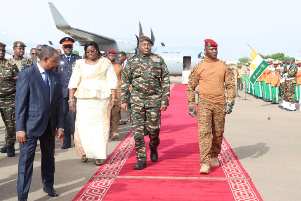 Niger's General Abdourahamane Tiani (L) revues a guard of honor next to his Burkinabe counterpart Captain Ibrahim Traore (R) upon his arrival in Niamey on July 5, 2024. A divided West Africa  hosts two presidential summits this weekend -- one in Niger between Sahel region military regime leaders, followed by another in Nigeria on Sunday with leaders of a wider economic bloc. Saturday's summit in Niger's capital Niamey, will mark the first between the military leaders of a new regional bloc, the Alliance of Sahel States (AES). Mali, Burkina Faso and Niger set up the mutual defence pact in September, leaving the wider Economic Community of West African States (ECOWAS) bloc in January. (Photo by AFP) (Photo by -/AFP via Getty Images)